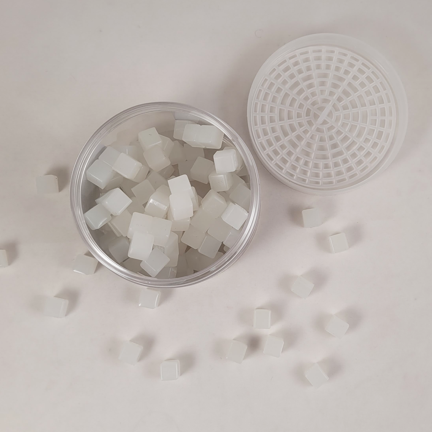 top of stickikubes container with kubes on table