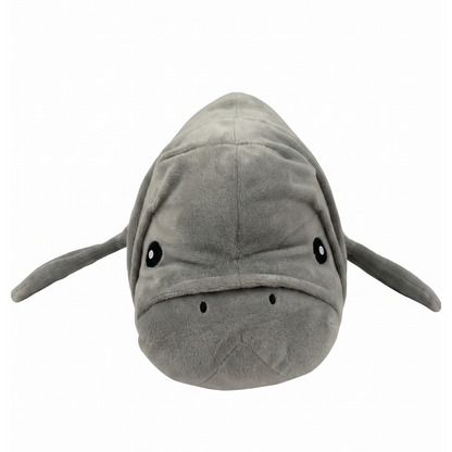 A plush manatee toy with a gray fuzzy body, black eyes, and small black nose details, shown against a plain white background.