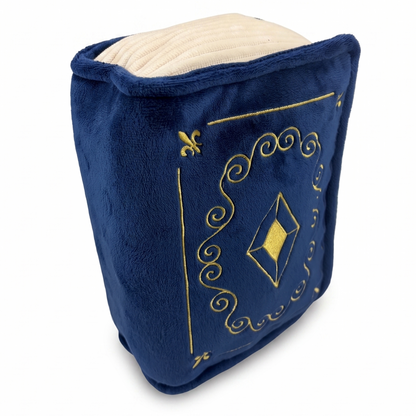 plush book with royal blue cover, cream pages, and gold embroidered details, set against a white background