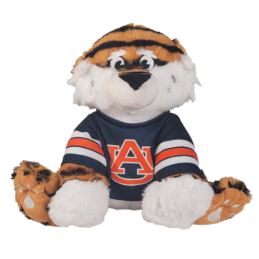 Plush toy in the shape of a tiger mascot wearing an Auburn Tigers jersey on a white background