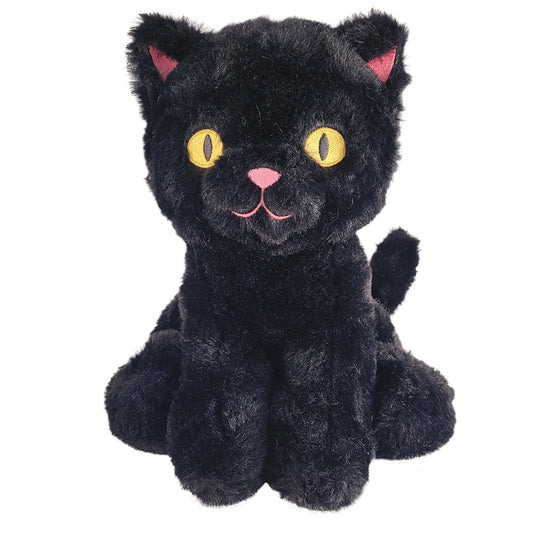 Black plush cat with yellow eyes on a white back background.