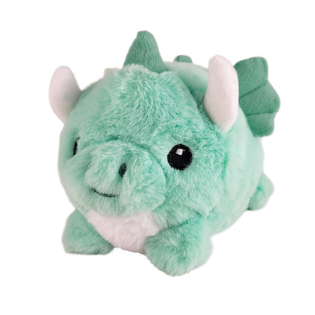 Small mint green baby dragon plush on a white background.