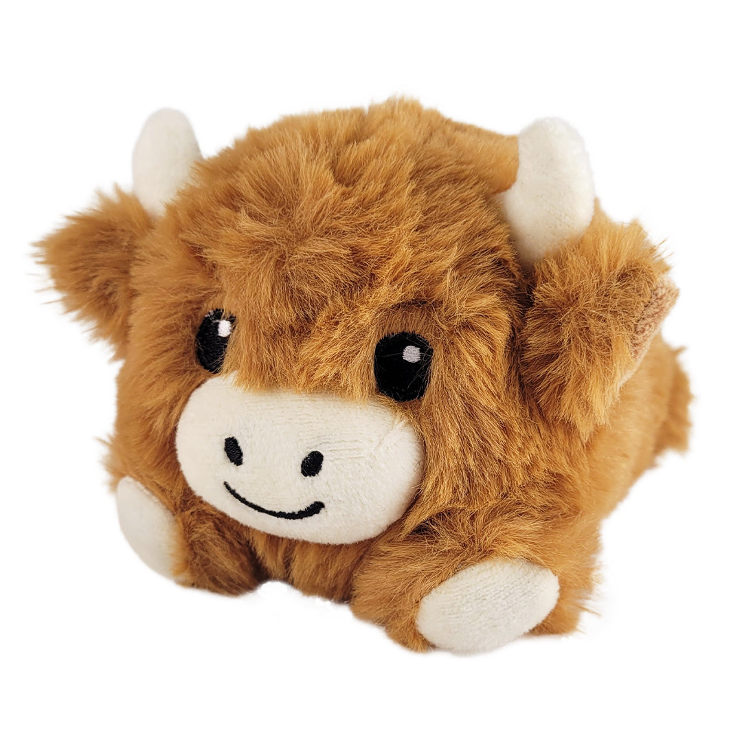 Small baby highland cow plush on a white background.