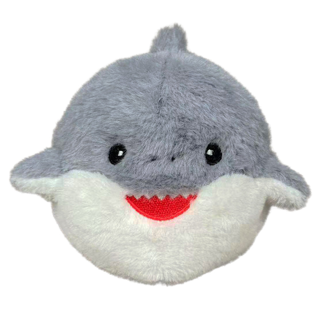 Small baby shark plush on a white background.