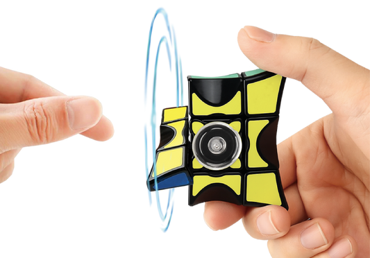 Fidget spinner held between two hands with a white background