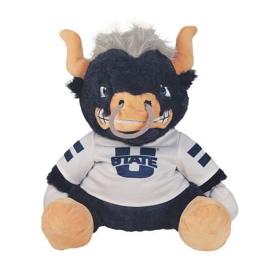 Plush blue bull toy with a wearing a shirt with a Utah State logo on a white background