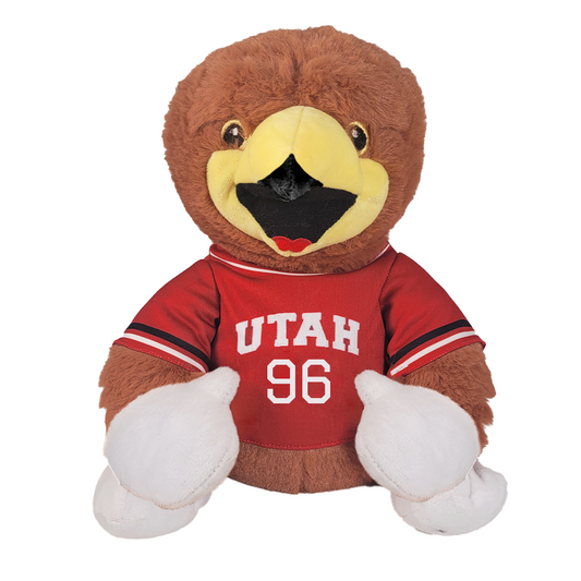 Plush toy hawk wearing a red 'Utah 96' shirt on a white background